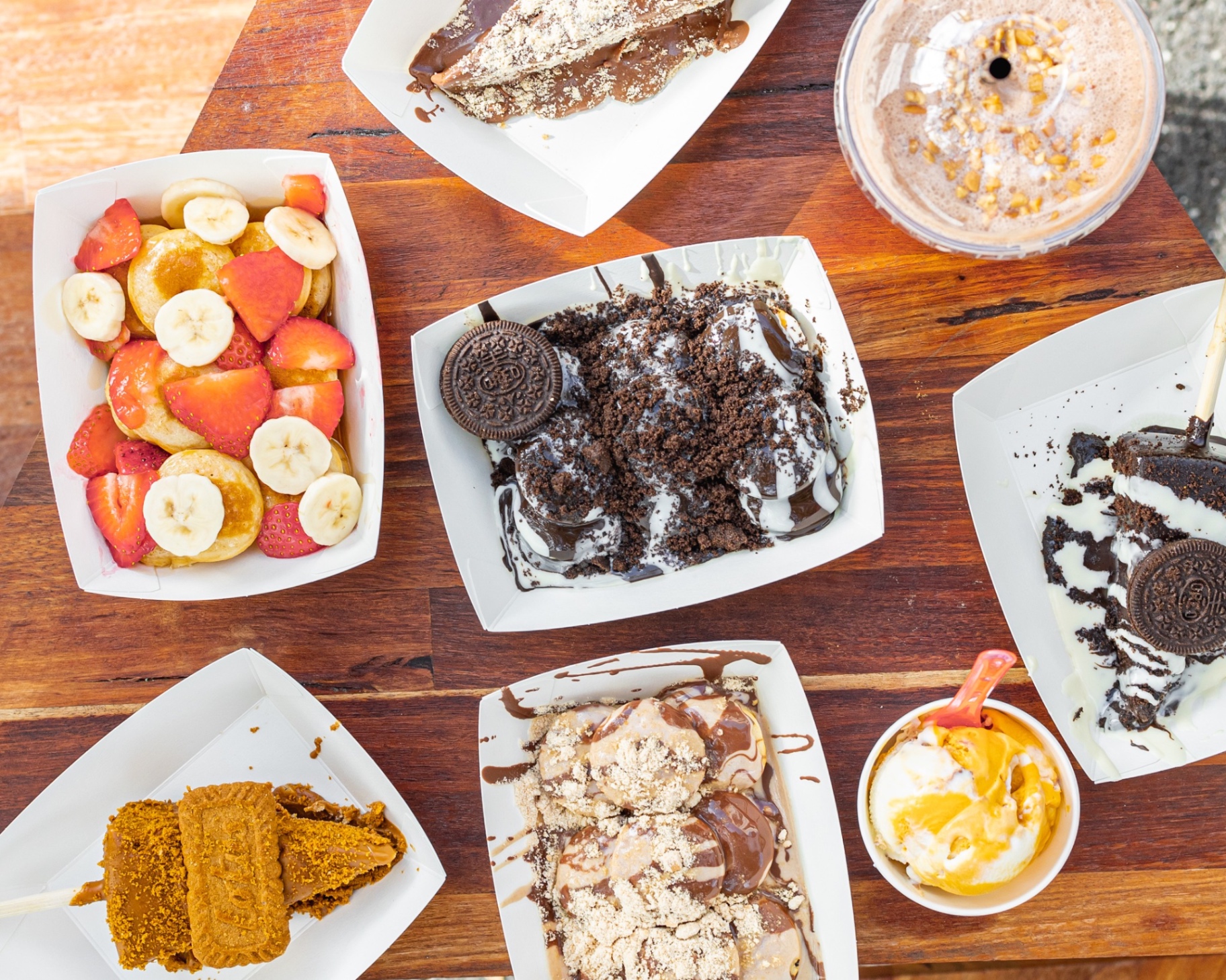 Flat lay of waffles, açaí and shakes