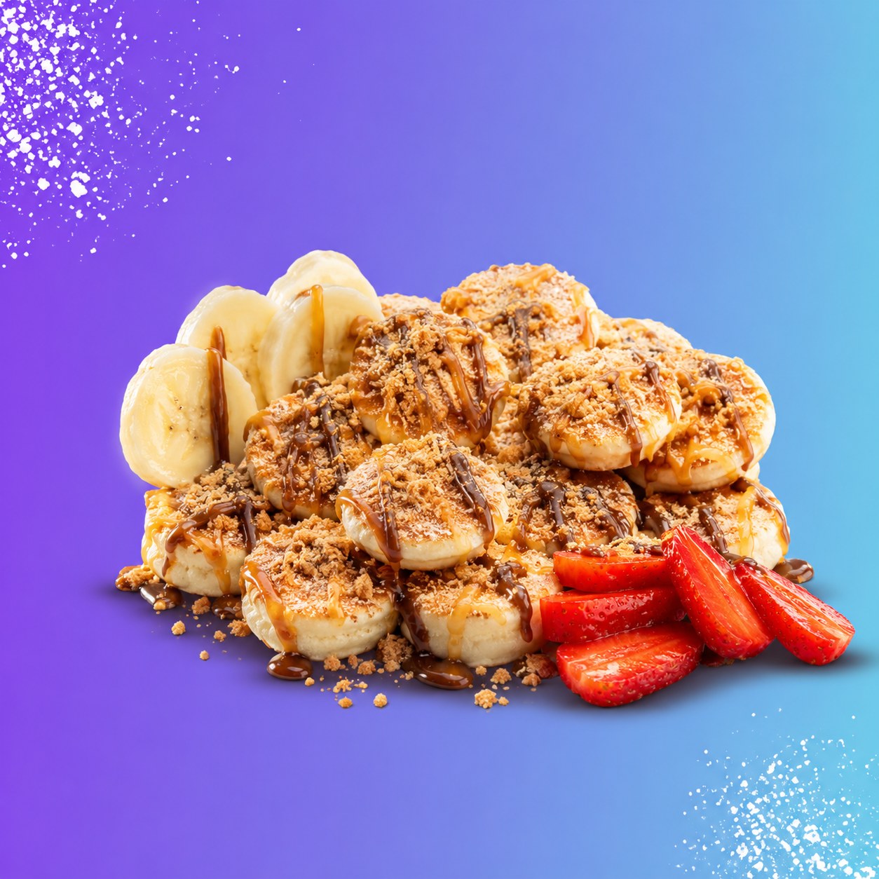 Tray of twenty golden Dutch mini pancakes topped with strawberries, banana, whipped cream and chocolate drizzle
