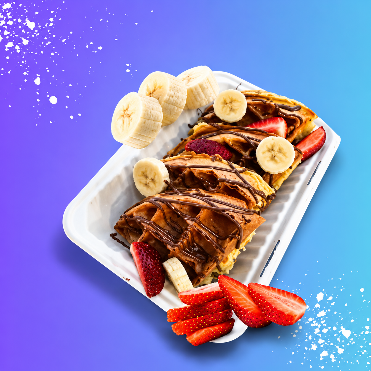 Loaded waffles and crepes drizzled with Nutella, topped with strawberries and banana